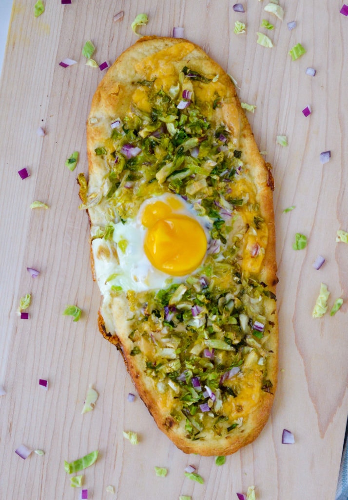 brussels sprouts pizza with an egg on top