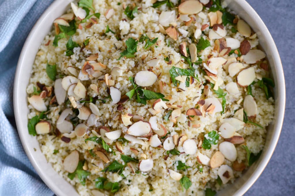 close up pic of couscous with parsley and zaatar vinaigrette