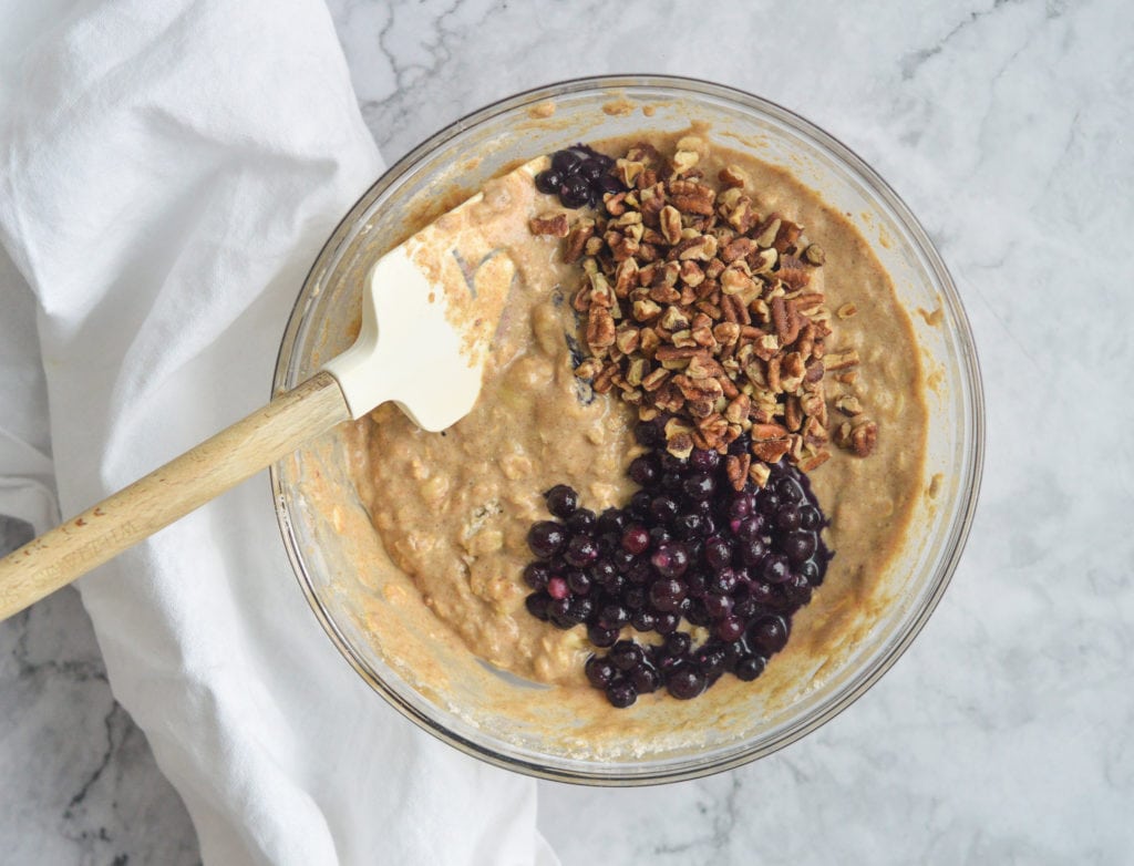 pancake batter with blueberries and pecans