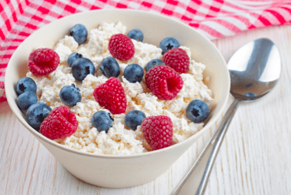 bowl of oatmeal with blueberries and raspberries